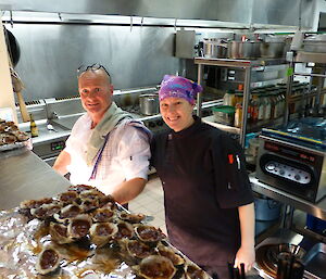 Chefs Rocket and Lesley standing at the servery.