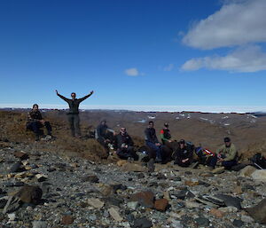 Eight expeditioners having a rest on their walk