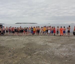 The swimmers pose for a photo in their bathers ready to take the plunge