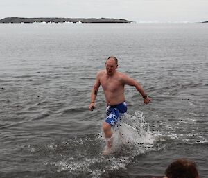 A swimmer showing the effects of the cold leaving the water