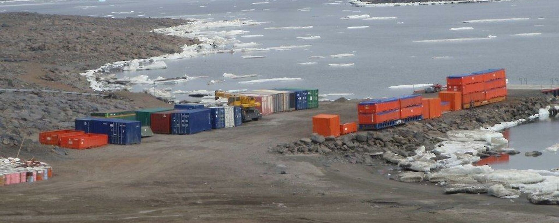 A photo of containers stacked ready for return to Australia on the Davis wharf