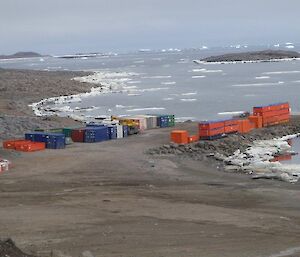A photo of containers stacked ready for return to Australia on the Davis wharf