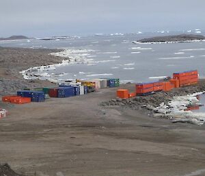 A photo of containers stacked ready for return to Australia on the Davis wharf