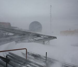 Wind blowing snow accross the above ground water pipes.