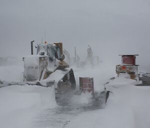 A bulldozer covered in snow