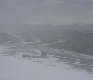 Limited view of the wharf from the front deck looking through the blowing snow.