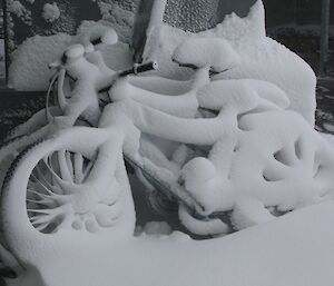 The station push bikes covered in snow