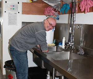 Gavin working in the kitchen doing the washing up