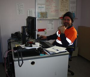 Mark sitting at his desk