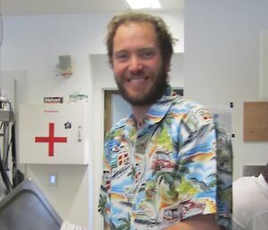 Pat doing the dishes after dinner in his Hawaiian shirt