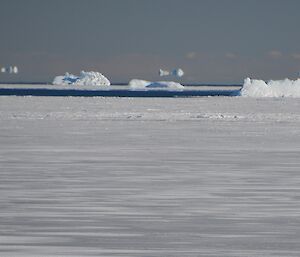 Icebergs on the horizon look to be floating in thin air