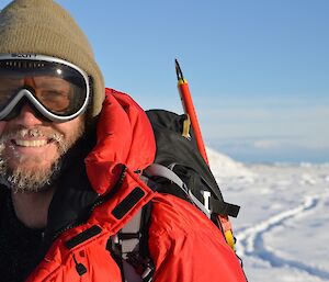 An expeditioner out in the cold weather with his beard partly frozen