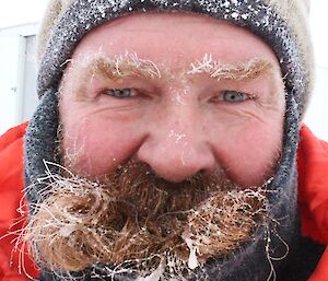 Close up photo of Jeff’s face with his frozen eyebrows and beard