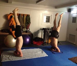 Rich and Bob doing yoga headstands