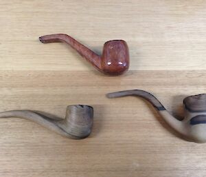 The three handmade pipes on display