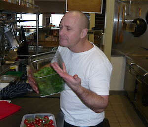 Rocket takes in the aroma of a fresh batch of herbs in the kitchen