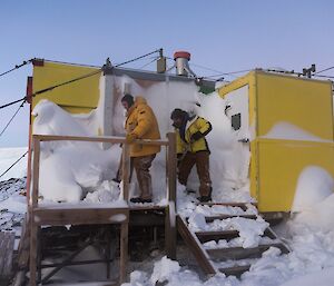 Gavin and Mark dig through blizz covering the entrance to the hut