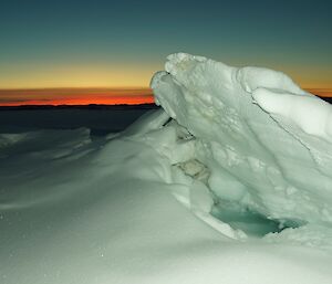 An ice eruption set against the twilight sky