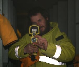 Expeditioner holding an infrared camera