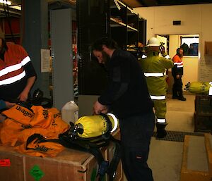 Expeditioners checking the BA cylinders and masks