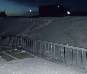 Snow mound much higher than the elevated walkway