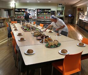 Chef Rodney adding the final plates of food to the table