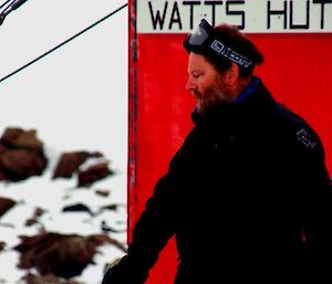 Bob in front of the Watts Hut sign