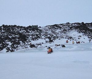 Bandits Hut on the rocky hill with quad bikes in the foreground