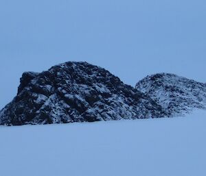 Large rocks jutting out of the sea ice