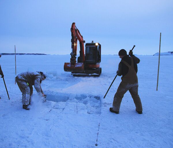 Starting to cut the ice hole for the swim