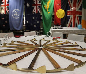 Wheel in the centre of the table made up from handmade wood-brass ice axes