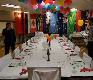 The midwinter table is set for 17 with the flags at the end