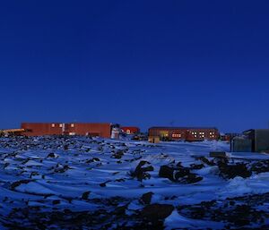 The waxing three-quarter super moon rises over station