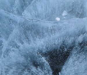 Air bubbles trapped in the frozen waters of a freshwater lake in the Vestfold Hills