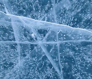 Air bubbles trapped in the frozen waters of a freshwater lake in the Vestfold