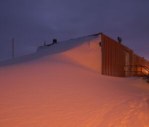 The blizz tail level with the top of the summer accommodation building roof