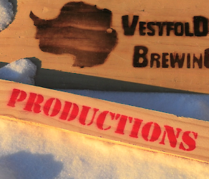 Picture of the opening movie introduction, wooden boards with “Vestfold Brewery Productions” burnt and stencilled on to them