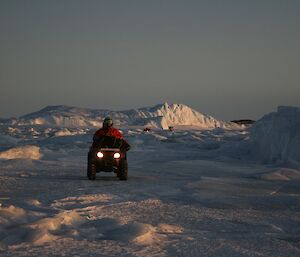 Quad bikes manoeuvering their way through the rafted ice