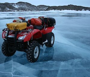 Quad bike parked on the frozen fresh water lake