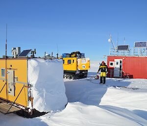 Rich walking between weather station container and accommodation module