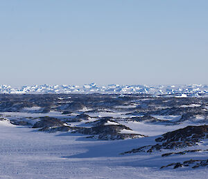 Looking across the Vestfolds to icebergs stuck in the sea ice