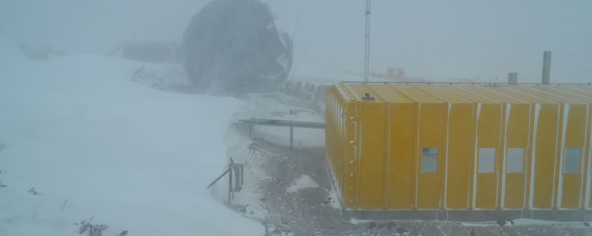 The stations communication satellite dome and operations building in poor weather conditions