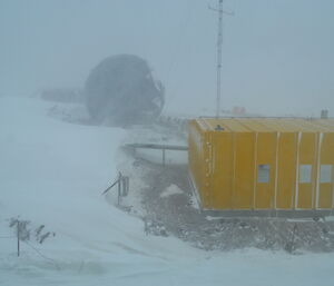 The stations communication satellite dome and operations building in poor weather conditions