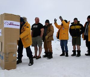 Expeditioners pretending to be cranky while they wait in line to vote