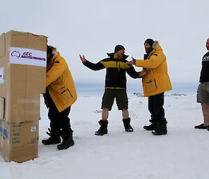 Expeditioners pretending to be cranky while they wait in line to vote