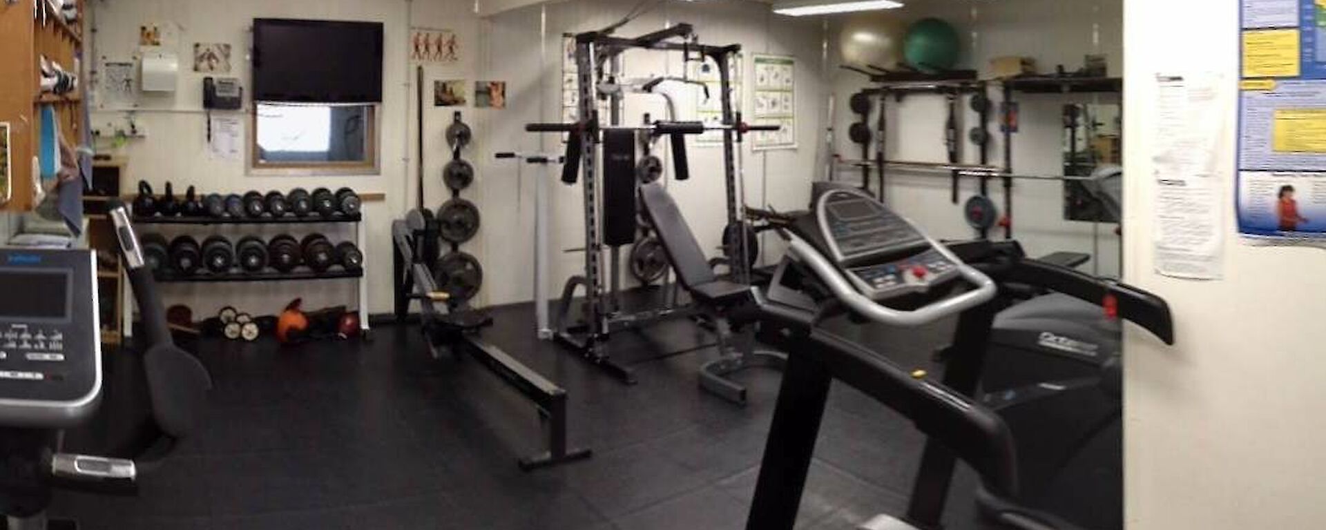 The station gymnasium with weights, tread mill, exercise bike and rowing machine