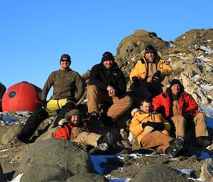 The complete Rauers group have a team photo with the Filla Island hut in the background
