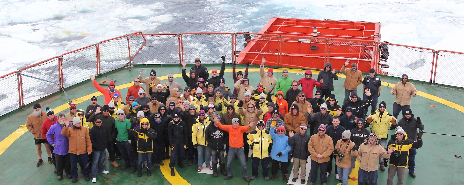 All the new Davis Expeditioners posing for a group photo on the helideck