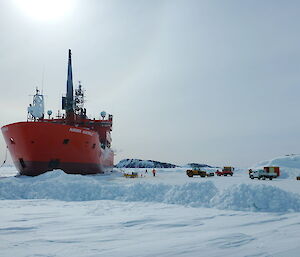 The sun lights up the ship and vehicles during resupply