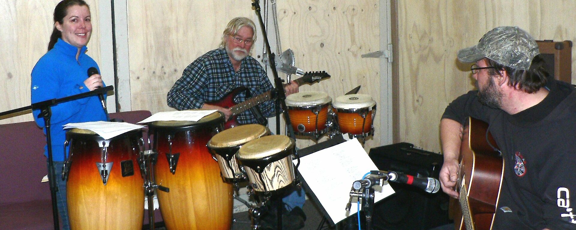 Three expeditioners practising for the band